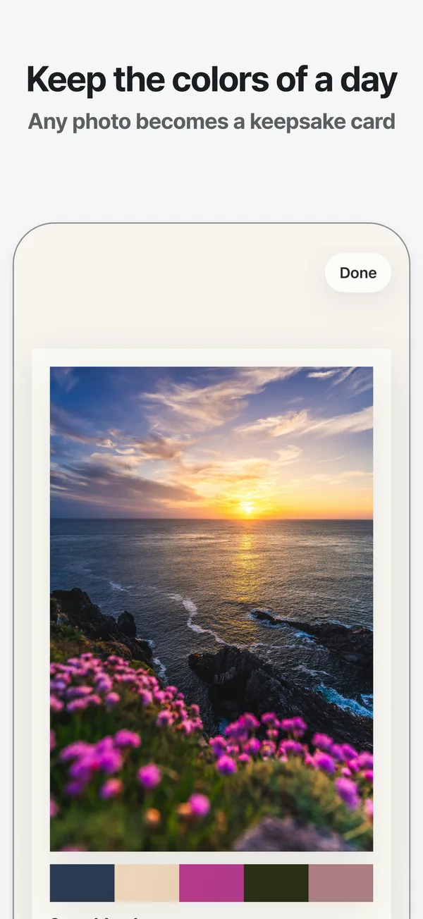 A seaside sunset photo card in the Paper style with its five colors and a caption